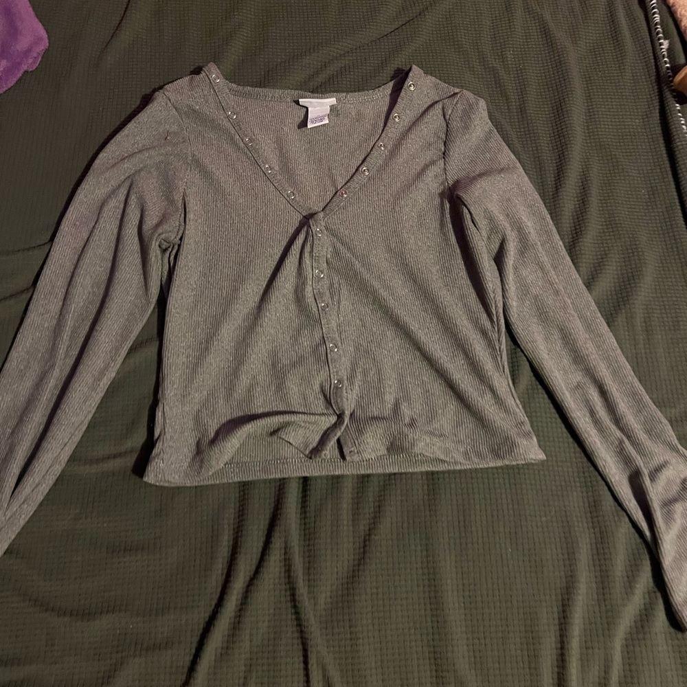 Gray long sleeve crop top with button down.